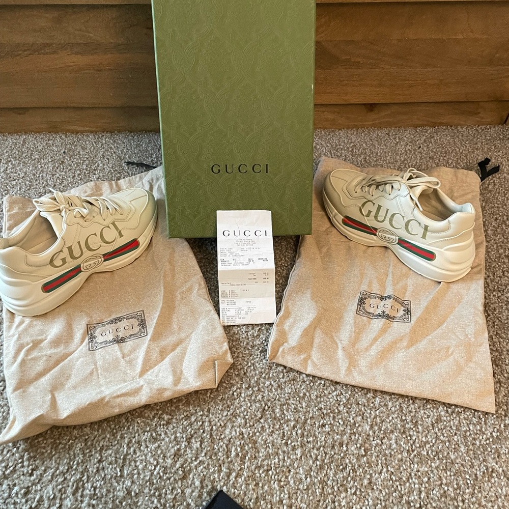 GUCCI Women's Rhyton Gucci logo leather sneaker.